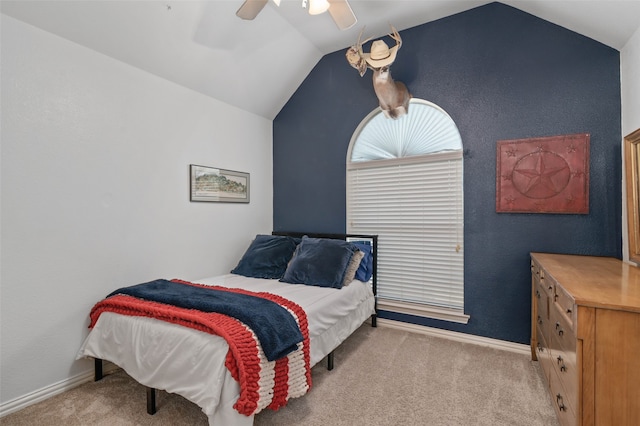 carpeted bedroom with ceiling fan and lofted ceiling