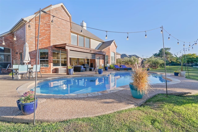 view of swimming pool with a patio area