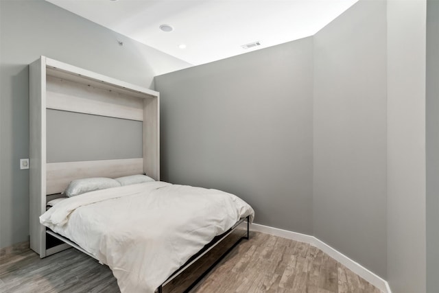 bedroom featuring hardwood / wood-style floors