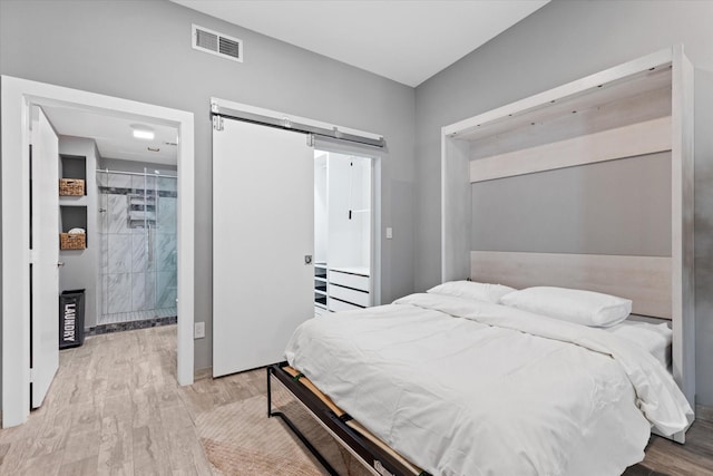 bedroom with light hardwood / wood-style flooring