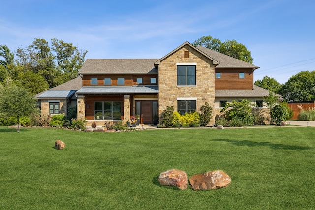 craftsman-style house featuring a front lawn