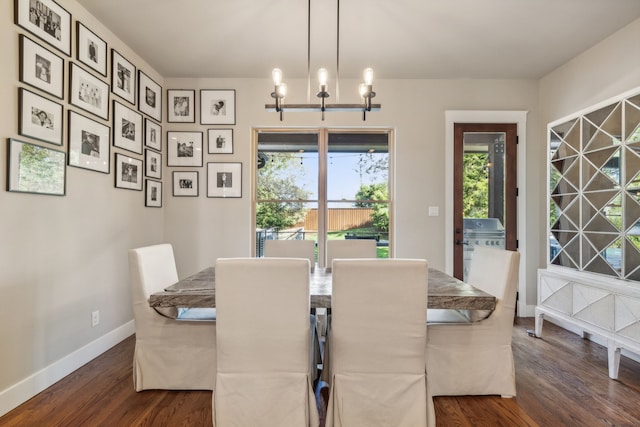 dining room featuring a chandelier and dark hardwood / wood-style floors