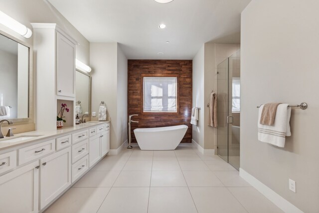 bathroom featuring tile patterned floors, vanity, and independent shower and bath