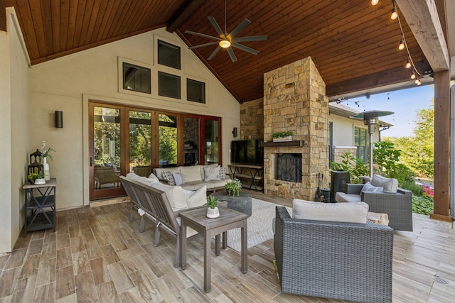 living room featuring ceiling fan, light wood-type flooring, wood ceiling, and high vaulted ceiling