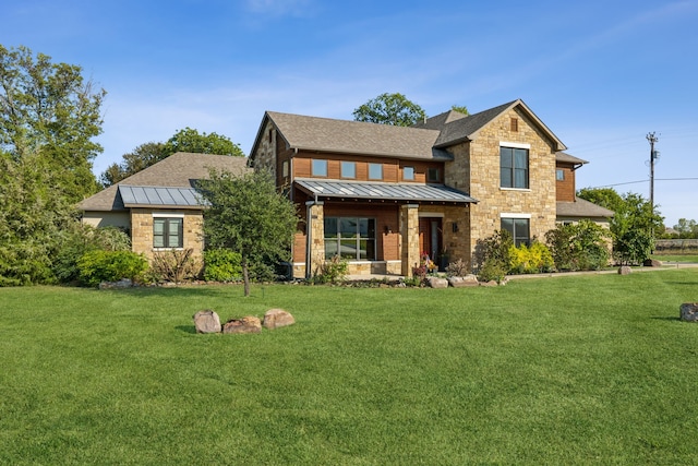 view of front of house with covered porch and a front lawn