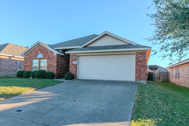 single story home featuring a front yard and a garage