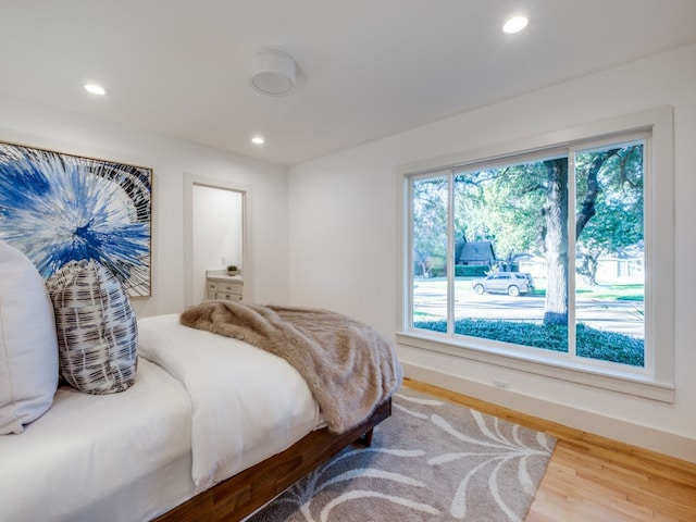 bedroom with hardwood / wood-style flooring