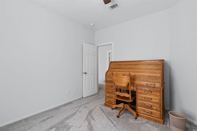 carpeted home office with ceiling fan