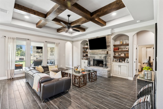 living room with coffered ceiling, a fireplace, beamed ceiling, and dark hardwood / wood-style floors