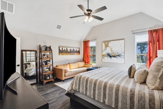 bedroom with ceiling fan, vaulted ceiling, wood-type flooring, and multiple windows