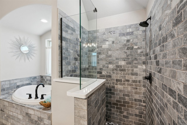 bathroom featuring separate shower and tub