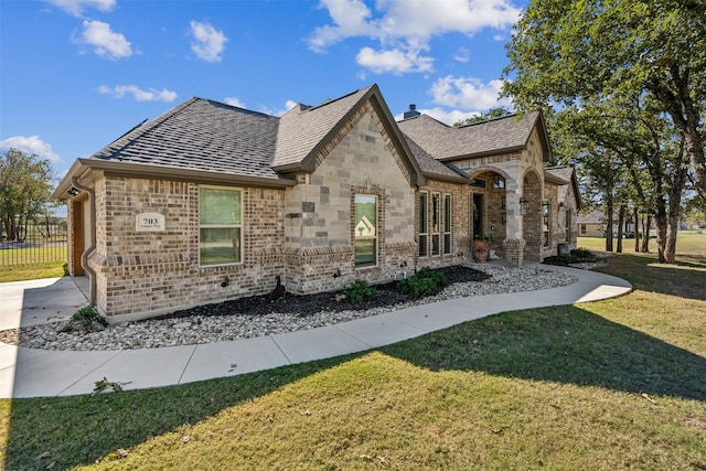 view of home's exterior with a yard