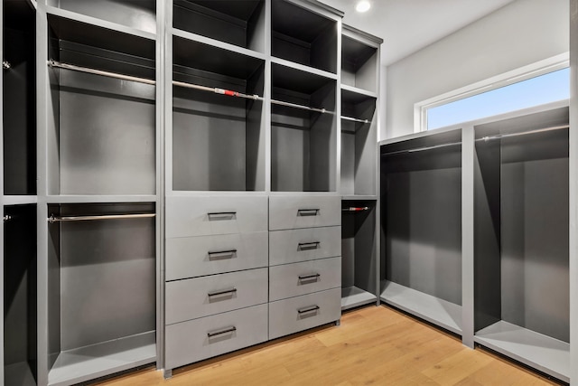 walk in closet featuring light hardwood / wood-style flooring