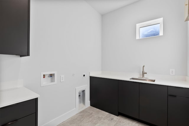 laundry area with cabinets, washer hookup, electric dryer hookup, sink, and hookup for a gas dryer