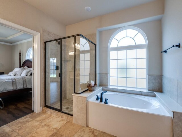 bathroom featuring crown molding, wood-type flooring, and shower with separate bathtub