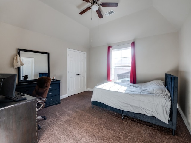 bedroom with ceiling fan, dark carpet, and vaulted ceiling