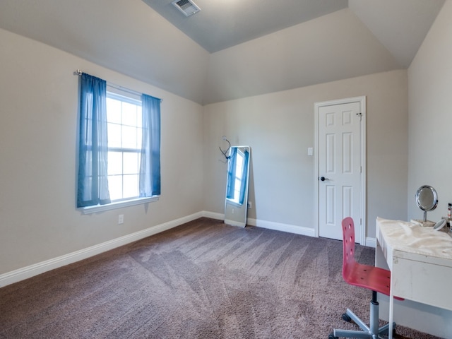 unfurnished office with carpet flooring and vaulted ceiling