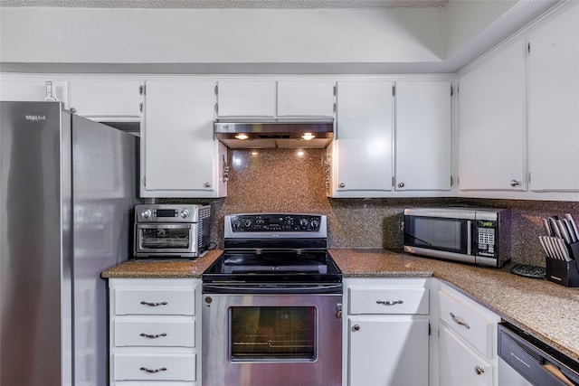 kitchen with tasteful backsplash, white cabinets, stone countertops, and appliances with stainless steel finishes