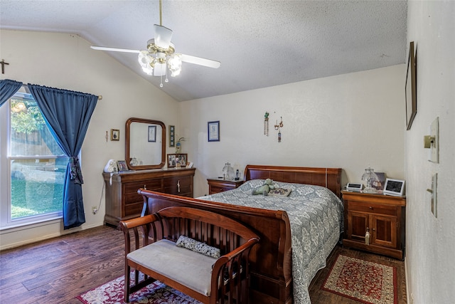 bedroom featuring multiple windows, ceiling fan, dark hardwood / wood-style flooring, and vaulted ceiling