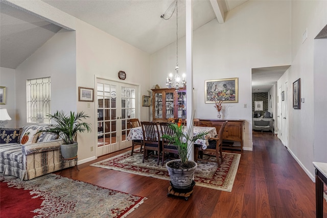 living room with french doors, dark hardwood / wood-style flooring, an inviting chandelier, high vaulted ceiling, and beamed ceiling