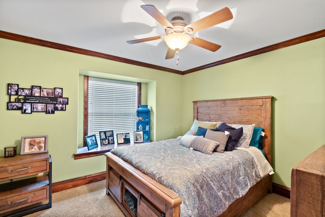 bedroom with ceiling fan, light colored carpet, and ornamental molding