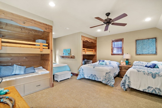 carpeted bedroom with vaulted ceiling and ceiling fan