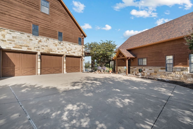 view of side of property with a garage