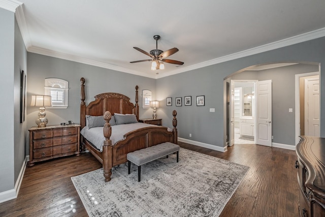 bedroom featuring ornamental molding, dark hardwood / wood-style floors, and ensuite bathroom