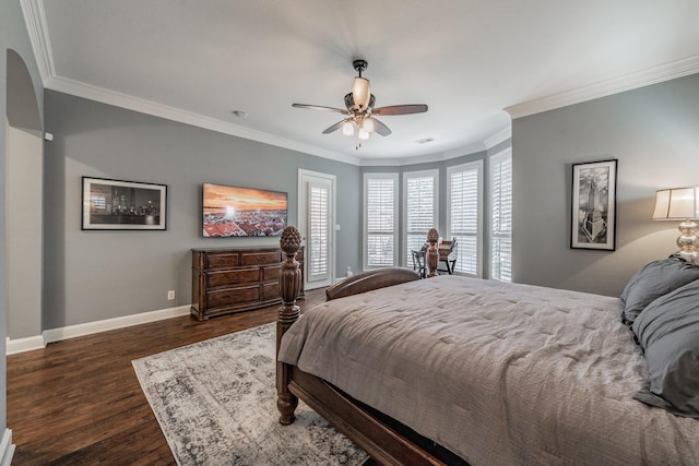 bedroom featuring crown molding, dark hardwood / wood-style floors, and ceiling fan