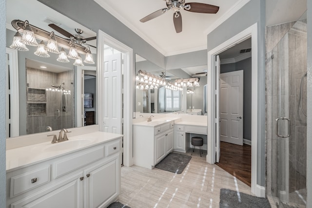 bathroom with vanity, crown molding, a shower with shower door, and ceiling fan