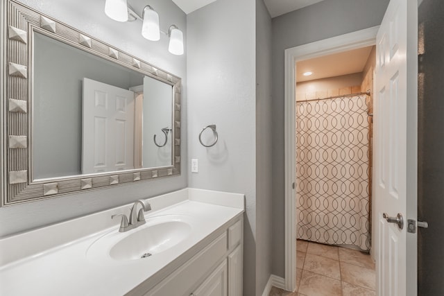 bathroom featuring vanity, curtained shower, and tile patterned floors