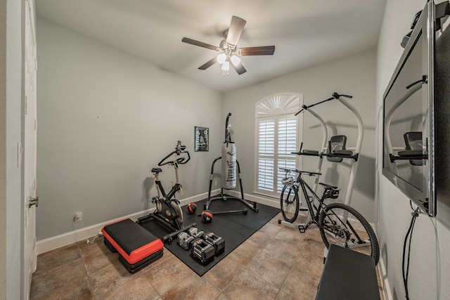 exercise room with ceiling fan