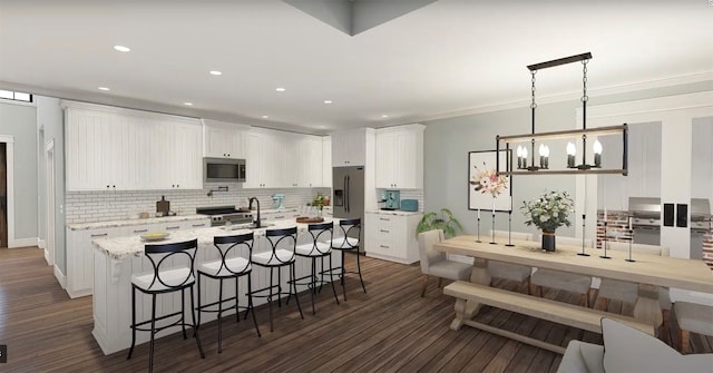 kitchen with white cabinetry, dark wood-type flooring, a chandelier, decorative light fixtures, and appliances with stainless steel finishes