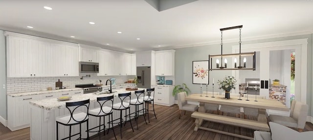 kitchen with white cabinets, decorative light fixtures, stainless steel appliances, and dark wood-type flooring