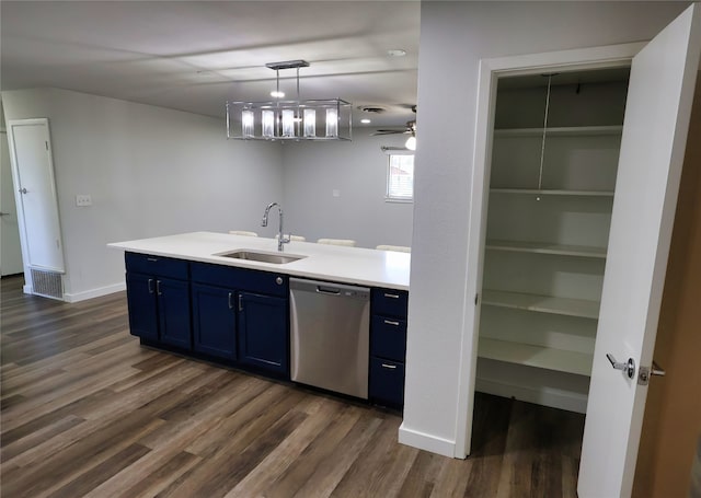 kitchen featuring dishwasher, sink, dark hardwood / wood-style floors, blue cabinets, and pendant lighting