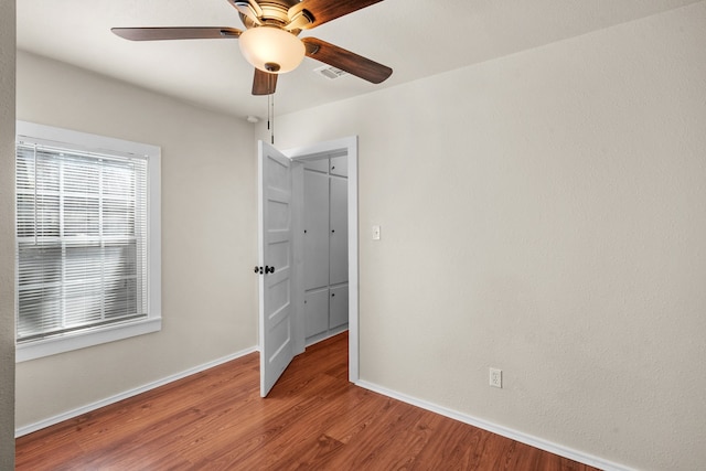 unfurnished bedroom featuring ceiling fan and wood-type flooring