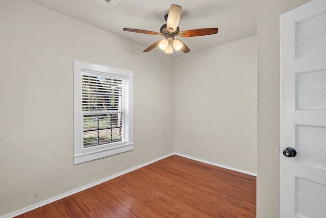 empty room featuring ceiling fan and hardwood / wood-style flooring