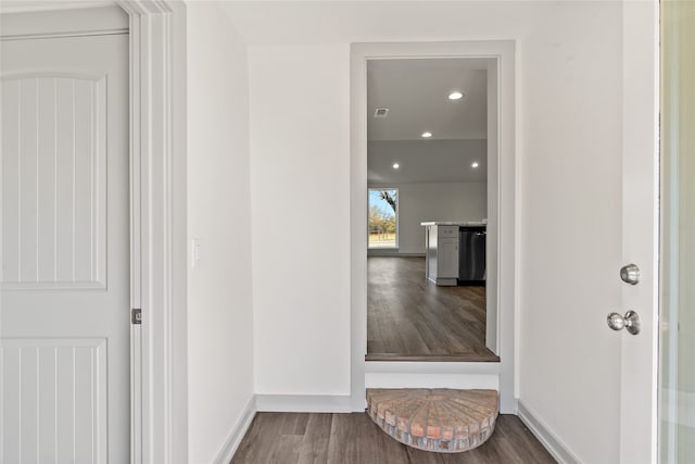 hall with dark hardwood / wood-style flooring