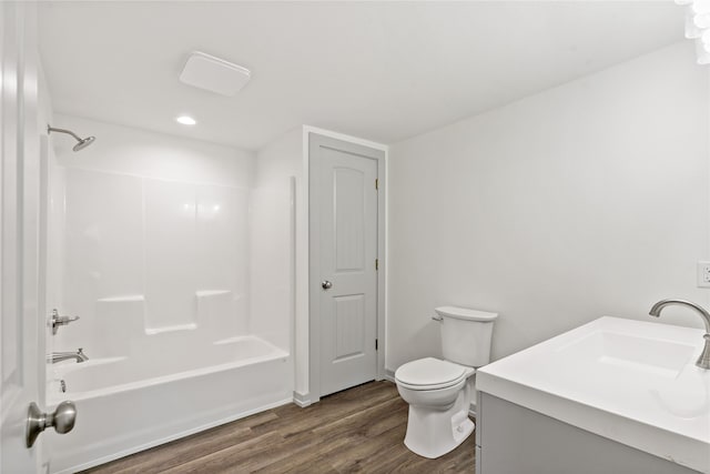 full bathroom featuring shower / bath combination, vanity, wood-type flooring, and toilet