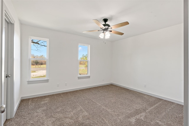 carpeted empty room with ceiling fan