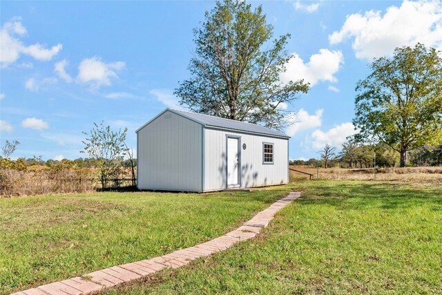 view of outdoor structure with a yard