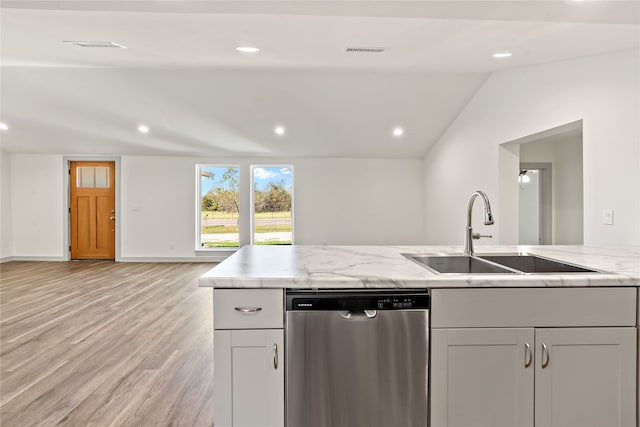 kitchen featuring light stone countertops, sink, dishwasher, light hardwood / wood-style floors, and lofted ceiling