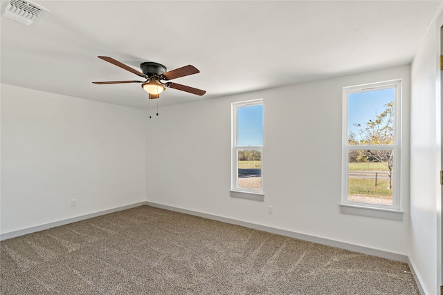 empty room with carpet flooring and ceiling fan