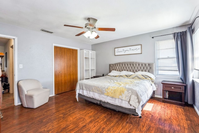 bedroom featuring ceiling fan and dark wood-type flooring