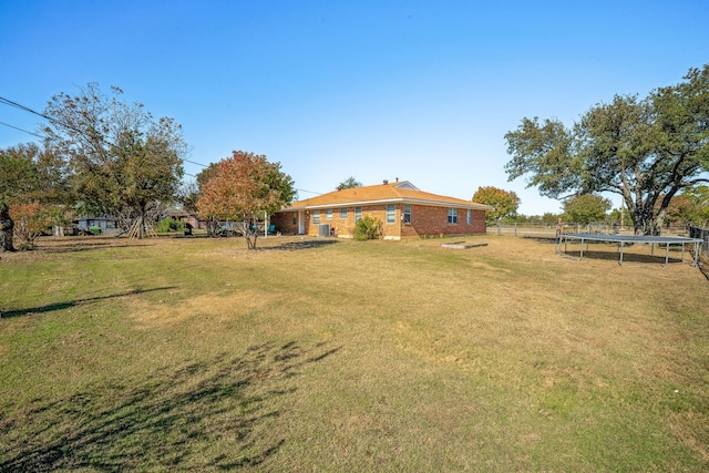 view of yard with a trampoline