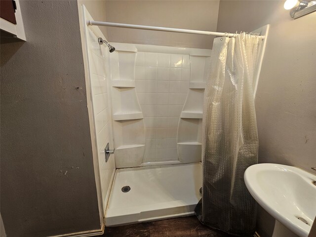 bathroom with sink and walk in shower