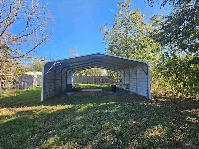 view of car parking featuring a yard and a carport