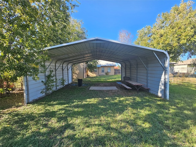 view of parking with a lawn and a carport