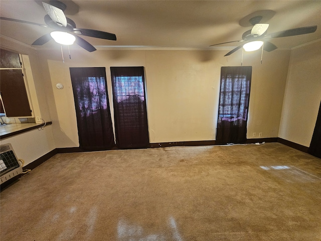 spare room with carpet floors, crown molding, and ceiling fan