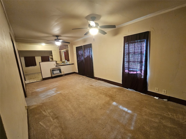 unfurnished living room with ceiling fan, light colored carpet, crown molding, and heating unit